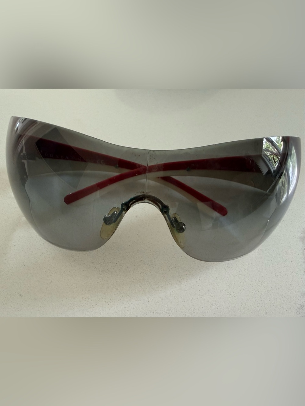 Prada Rimless Shield Sunglasses in Clear Gradient with Red/White stripe - Picture 10 of 11